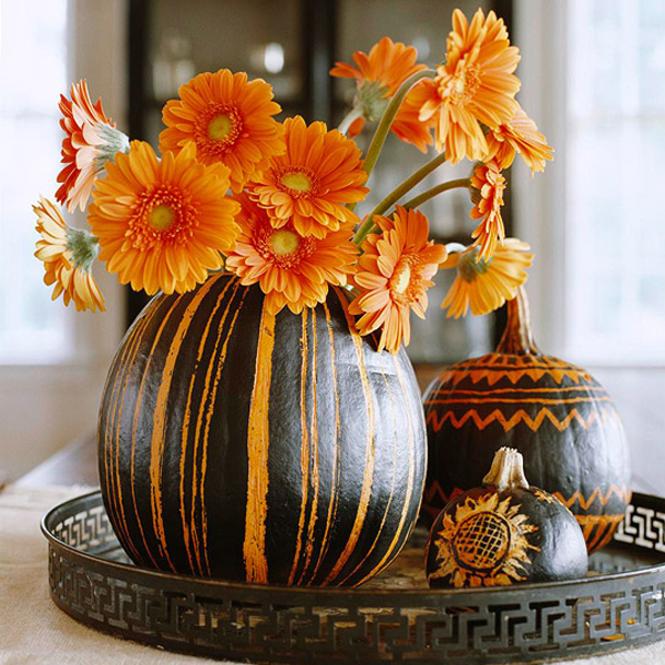 appealing-easy-pumpkin-carving-ideas-applying-vase-design-with-orange-and-black-paint-of-hallowen-themes-also-completed-with-orange-flowers-for-decorations